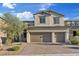 Charming two-story home boasts a 2-car garage and well-manicured landscaping at 10057 Matter Overlook Dr, Las Vegas, NV 89178