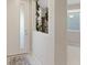 Bright foyer with a neutral palette and tiled floors, showcasing modern design elements at 10057 Matter Overlook Dr, Las Vegas, NV 89178