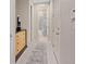 Hallway showcases a dresser for storage leading to a bathroom with a stylish shower curtain at 10057 Matter Overlook Dr, Las Vegas, NV 89178
