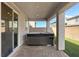Covered patio features a relaxing hot tub on a brick paver surface, great for outdoor enjoyment at 10057 Matter Overlook Dr, Las Vegas, NV 89178
