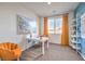 Bright home office with a large window, desk, and comfortable seating for a productive workspace at 1013 Gentle Swan St # 696, Henderson, NV 89011