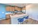 Well-equipped kitchen with a spacious island, stainless steel appliances, and modern countertops at 1013 Gentle Swan St # 696, Henderson, NV 89011