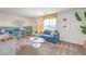 Cozy room features a seating area with comfortable seating, window, and natural light at 1013 Gentle Swan St # 696, Henderson, NV 89011