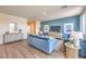 Bright living room featuring stylish decor, comfortable seating, and hardwood floors at 1013 Gentle Swan St # 696, Henderson, NV 89011