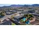 Property with a private pool, mature trees, grassy areas and mountain views at 10140 W Tropical Pkwy, Las Vegas, NV 89149