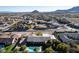 Expansive single-story home featuring a private pool, lush landscaping, and mountain views at 10140 W Tropical Pkwy, Las Vegas, NV 89149