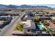Single-story property with desert landscaping, mountain views, and mature trees at 10140 W Tropical Pkwy, Las Vegas, NV 89149
