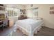 Cozy bedroom featuring a quaint work area and natural light at 10140 W Tropical Pkwy, Las Vegas, NV 89149
