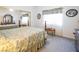 Bedroom featuring mirrored closet and a detailed bedding set at 10140 W Tropical Pkwy, Las Vegas, NV 89149