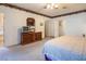Spacious main bedroom features soft carpet, wood dresser, and three points of entry at 10140 W Tropical Pkwy, Las Vegas, NV 89149