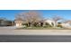 Attractive desert home with a well-manicured lawn and ample parking space at 10140 W Tropical Pkwy, Las Vegas, NV 89149