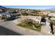 Single-story home with desert landscaping, covered carport, and mature shade trees at 10140 W Tropical Pkwy, Las Vegas, NV 89149