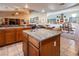 Kitchen islands featuring granite countertops overlooking dining and living room at 10140 W Tropical Pkwy, Las Vegas, NV 89149