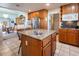 Kitchen island featuring granite countertops and stainless steel sink at 10140 W Tropical Pkwy, Las Vegas, NV 89149