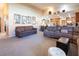 Spacious living room with vaulted ceilings leading into an open-concept kitchen at 10140 W Tropical Pkwy, Las Vegas, NV 89149