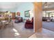 Open living space with a view of the dining area, seating, and an adjacent room at 10140 W Tropical Pkwy, Las Vegas, NV 89149