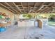 Outdoor kitchen features a built-in grill, refrigerator, and countertop space for entertaining at 10140 W Tropical Pkwy, Las Vegas, NV 89149