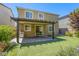 Charming backyard featuring a patio, pergola, artificial turf, and lush landscaping at 10164 Phelps Lake Ct, Las Vegas, NV 89148