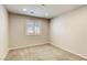 Neutral bedroom featuring neutral carpet, walls, and natural light from the window at 10164 Phelps Lake Ct, Las Vegas, NV 89148