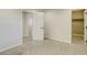 Bright bedroom featuring a carpeted floor, recessed lights, and multiple doorways at 10164 Phelps Lake Ct, Las Vegas, NV 89148