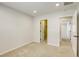 Neutral bedroom featuring neutral carpet, walls, multiple doorways and recessed lighting at 10164 Phelps Lake Ct, Las Vegas, NV 89148
