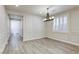 Bright dining area featuring stylish light fixture, and beautiful decorative wall paneling at 10164 Phelps Lake Ct, Las Vegas, NV 89148