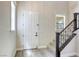 Welcoming foyer features a staircase and view of the front door at 10164 Phelps Lake Ct, Las Vegas, NV 89148
