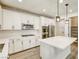 A pristine white kitchen featuring sleek stainless appliances, a gas range, and spacious island at 10164 Phelps Lake Ct, Las Vegas, NV 89148