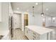 Open concept kitchen with stainless appliances, large island, and a walk-in pantry at 10164 Phelps Lake Ct, Las Vegas, NV 89148