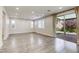 Bright living room featuring wood floors, recessed lights and sliding door access to the backyard at 10164 Phelps Lake Ct, Las Vegas, NV 89148