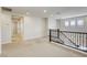 Spacious loft area with plush carpet, providing a comfortable and versatile space at 10164 Phelps Lake Ct, Las Vegas, NV 89148