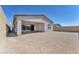 Home featuring a covered patio, gravel backyard, and privacy walls at 11707 Hatchling Ave, Las Vegas, NV 89138