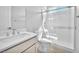 Modern bathroom featuring a walk-in shower with glass door and a vanity with white countertop at 11707 Hatchling Ave, Las Vegas, NV 89138