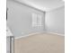 Bright, carpeted bedroom with light-colored walls, a window with shutters, and white trim at 11707 Hatchling Ave, Las Vegas, NV 89138