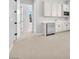 Living area includes bar with stainless steel mini fridge, carpet, and white cabinets at 11707 Hatchling Ave, Las Vegas, NV 89138