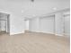 Expansive living area with light wood floors and recessed lighting at 11707 Hatchling Ave, Las Vegas, NV 89138