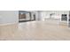 Spacious living area with sliding glass doors and a modern kitchen at 11707 Hatchling Ave, Las Vegas, NV 89138