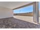 Covered patio with brick pavers, plus gravel backyard and block wall at 11707 Hatchling Ave, Las Vegas, NV 89138