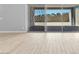 Sliding glass doors open to the backyard, with neutral gray walls and light wood-look floors at 11707 Hatchling Ave, Las Vegas, NV 89138