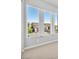 Bright room with large windows offering views of neighboring homes at 11707 Hatchling Ave, Las Vegas, NV 89138