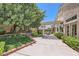 Backyard featuring a pergola covered patio, artificial grass, and lush landscaping at 1314 Rossini St, Henderson, NV 89052