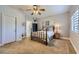 Bedroom featuring neutral walls, ceiling fan, and natural light from a window at 1314 Rossini St, Henderson, NV 89052