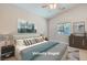 Staged bedroom featuring a stylish bed, natural light, and modern decor at 1314 Rossini St, Henderson, NV 89052