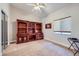 Spacious bedroom with custom built-ins, neutral carpet, and ambient light at 1314 Rossini St, Henderson, NV 89052