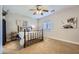 Bedroom featuring neutral walls, ceiling fan, and natural light from a window at 1314 Rossini St, Henderson, NV 89052