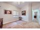 Bright bedroom featuring neutral carpet, natural light, and stylish wall decor at 1314 Rossini St, Henderson, NV 89052