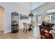 Cozy dining area adjacent to the living room, featuring elegant furnishings and natural light at 1314 Rossini St, Henderson, NV 89052
