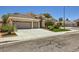 Charming single-story home with mature landscaping, a well-manicured lawn and a three-car garage at 1314 Rossini St, Henderson, NV 89052