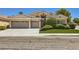 Charming single-story home featuring a well-manicured lawn and a spacious three-car garage at 1314 Rossini St, Henderson, NV 89052