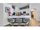 Stylish kitchen with a breakfast bar, granite countertops, and ample cabinet space at 1314 Rossini St, Henderson, NV 89052